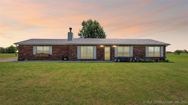 30955 S 4240th Rd, Inola, OK 74036 - single story home with a chimney, a front lawn, and brick siding