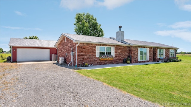 30955 S 4240th Rd, Inola, OK 74036 - ranch-style home featuring driveway, a chimney, a front yard, brick siding, and ac unit