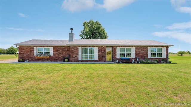 30955 S 4240th Rd, Inola, OK 74036 - ranch-style house featuring a chimney, a front lawn, and brick siding