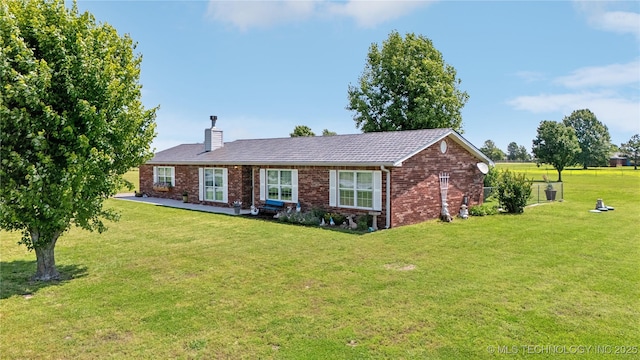 30955 S 4240th Rd, Inola, OK 74036 - ranch-style home with brick siding, a front yard, and a chimney