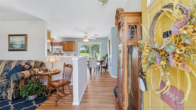 30955 S 4240th Rd, Inola, OK 74036 - foyer entrance featuring light wood finished floors, ceiling fan, and baseboards