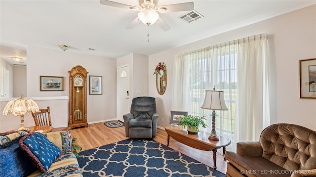 30955 S 4240th Rd, Inola, OK 74036 - living area with plenty of natural light, wood finished floors, ceiling fan, and baseboards