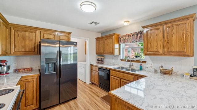 30955 S 4240th Rd, Inola, OK 74036 - kitchen with stainless steel fridge, a sink, dishwasher, range, and brown cabinets