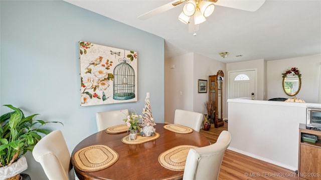 30955 S 4240th Rd, Inola, OK 74036 - dining space featuring wood finished floors and a ceiling fan