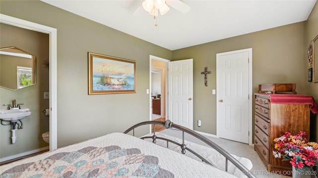 30955 S 4240th Rd, Inola, OK 74036 - bedroom with baseboards, carpet floors, connected bathroom, and a ceiling fan