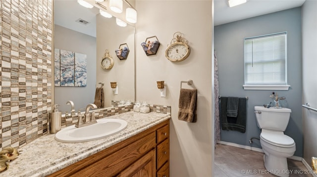 30955 S 4240th Rd, Inola, OK 74036 - bathroom featuring toilet, tile patterned floors, vanity, backsplash, and baseboards