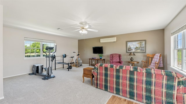 30955 S 4240th Rd, Inola, OK 74036 - living room featuring an AC wall unit, ceiling fan, baseboards, and carpet