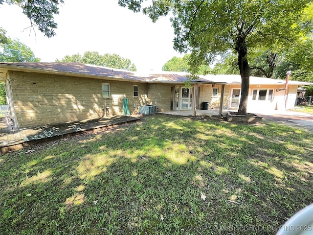 116800 S 4300th Rd, Porum, OK 74455 - rear view of property featuring a lawn and central AC unit
