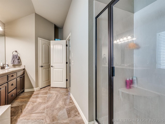 18210 E 49th St, Tulsa, OK 74134 - bathroom with vanity, a shower stall, baseboards, and lofted ceiling