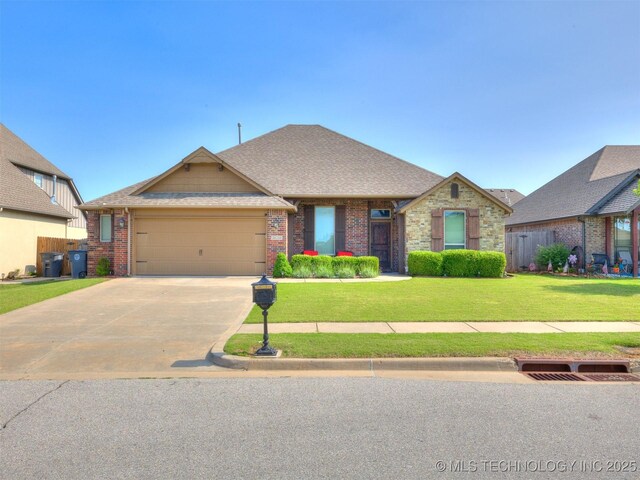 18210 E 49th St, Tulsa, OK 74134 - view of front of home with a garage, a front yard, concrete driveway, brick siding, and a shingled roof