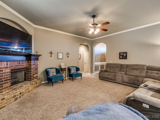 18210 E 49th St, Tulsa, OK 74134 - carpeted living area featuring arched walkways, ceiling fan, baseboards, crown molding, and a fireplace