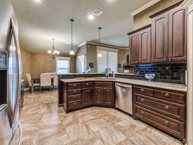 18210 E 49th St, Tulsa, OK 74134 - kitchen with appliances with stainless steel finishes, a sink, crown molding, a peninsula, and dark brown cabinets