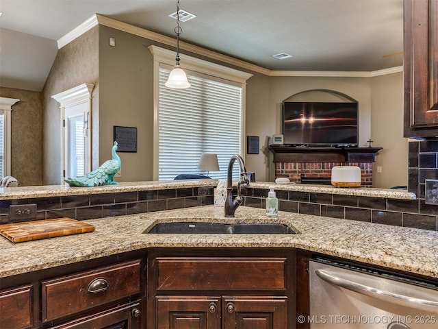 18210 E 49th St, Tulsa, OK 74134 - kitchen with a sink, dishwasher, dark brown cabinets, light stone counters, and crown molding