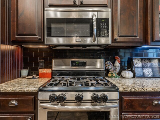18210 E 49th St, Tulsa, OK 74134 - kitchen with stainless steel appliances, dark brown cabinetry, decorative backsplash, and light stone counters
