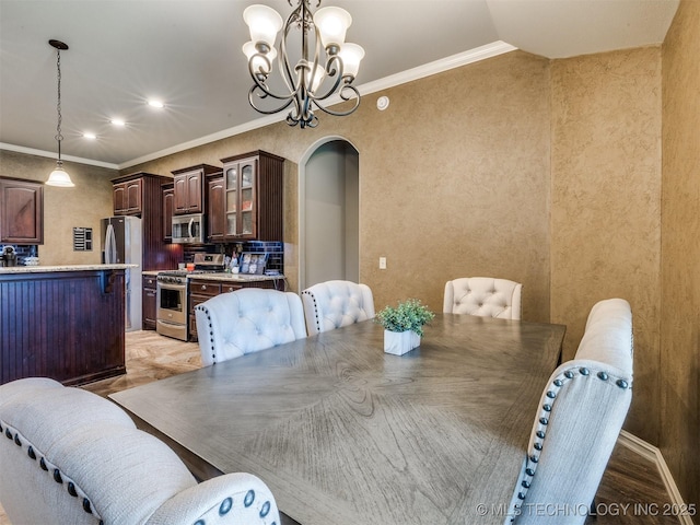 18210 E 49th St, Tulsa, OK 74134 - dining area featuring a chandelier, arched walkways, light wood-style floors, crown molding, and recessed lighting