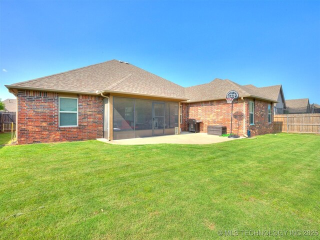 18210 E 49th St, Tulsa, OK 74134 - rear view of property with a sunroom, brick siding, a patio, and roof with shingles