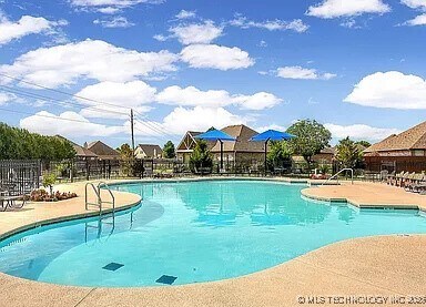 18210 E 49th St, Tulsa, OK 74134 - community pool featuring a patio