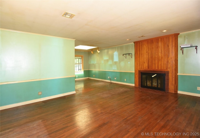 464 S Allegheny Ave, Tulsa, OK 74112 - unfurnished living room featuring wood finished floors, a fireplace, baseboards, ornamental molding, and recessed lighting