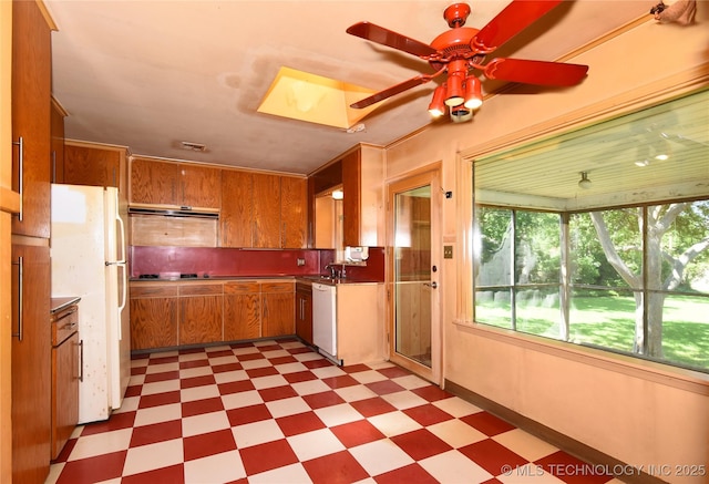 464 S Allegheny Ave, Tulsa, OK 74112 - kitchen with light flooring, white appliances, brown cabinetry, ventilation hood, and ceiling fan