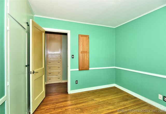 464 S Allegheny Ave, Tulsa, OK 74112 - unfurnished bedroom featuring dark wood-style flooring, ornamental molding, and baseboards