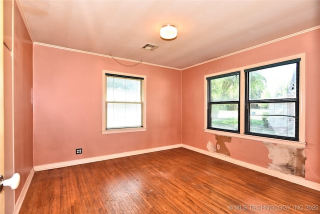 464 S Allegheny Ave, Tulsa, OK 74112 - spare room with healthy amount of natural light, hardwood / wood-style floors, baseboards, and crown molding
