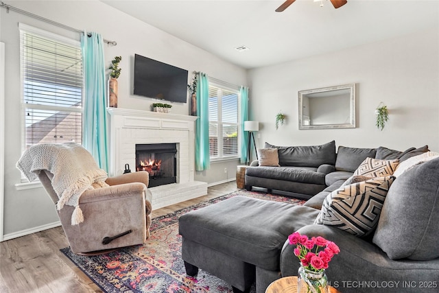 2023 E 133rd St S, Bixby, OK 74008 - living room featuring ceiling fan, baseboards, wood finished floors, and a fireplace