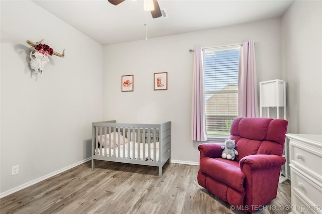 2023 E 133rd St S, Bixby, OK 74008 - bedroom with wood finished floors, baseboards, and a ceiling fan