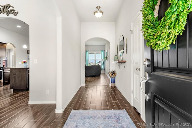 2023 E 133rd St S, Bixby, OK 74008 - entrance foyer featuring arched walkways, wood tiled floors, and baseboards