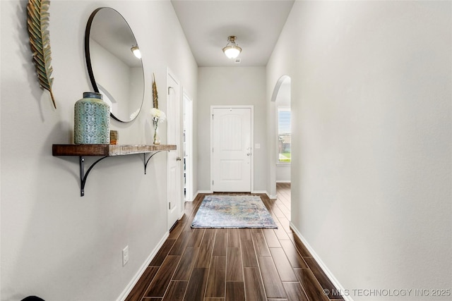 2023 E 133rd St S, Bixby, OK 74008 - entryway with arched walkways, baseboards, and dark wood finished floors
