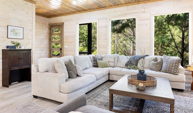 62 Hickory Canyon Trl, Broken Bow, OK 74728 - living room with wooden ceiling, wood walls, and light wood-style floors