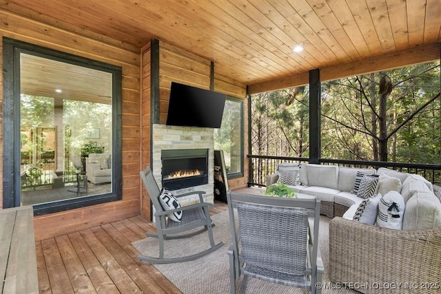 62 Hickory Canyon Trl, Broken Bow, OK 74728 - wooden terrace featuring an outdoor living space with a fireplace