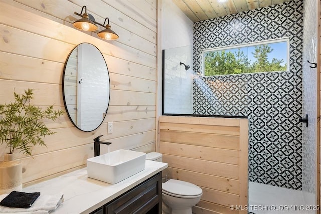 62 Hickory Canyon Trl, Broken Bow, OK 74728 - bathroom featuring wooden walls, vanity, a tile shower, and wooden ceiling