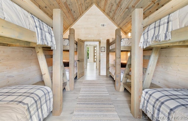 62 Hickory Canyon Trl, Broken Bow, OK 74728 - bedroom with wooden walls, wooden ceiling, vaulted ceiling, and wood finished floors