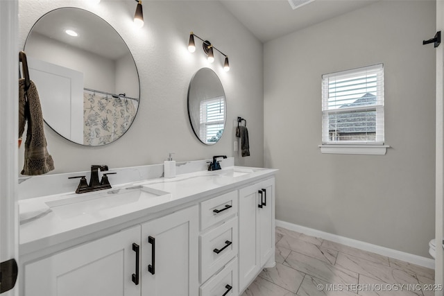 5769 S 256th E Ave, Broken Arrow, OK 74014 - full bathroom with marble look tile flooring, double vanity, baseboards, and toilet