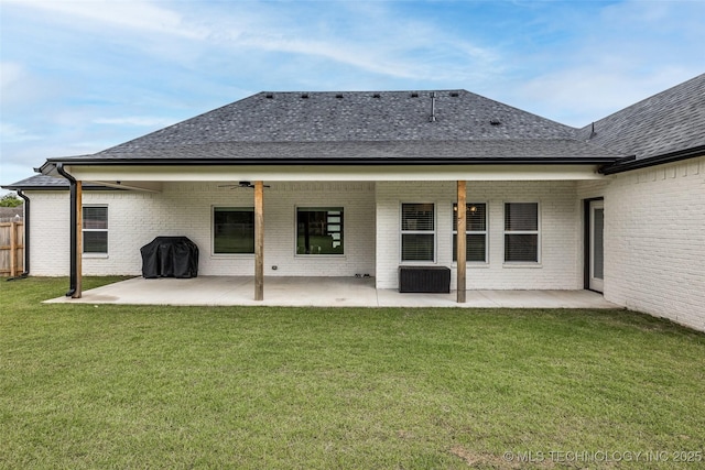 5769 S 256th E Ave, Broken Arrow, OK 74014 - back of house with a shingled roof, a patio, and brick siding
