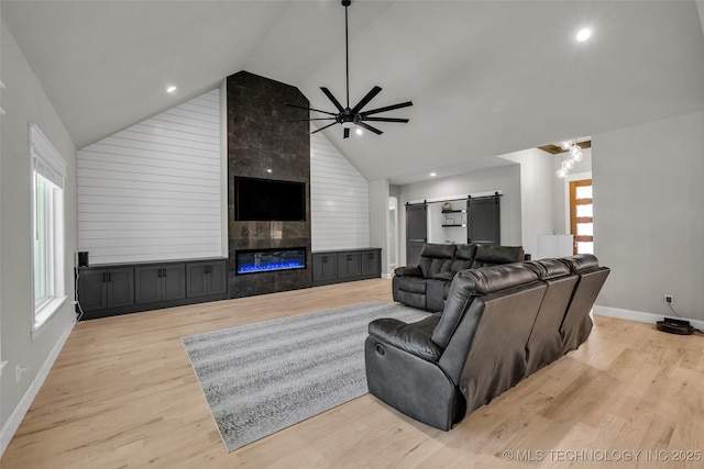5769 S 256th E Ave, Broken Arrow, OK 74014 - living room with a ceiling fan, healthy amount of natural light, a tile fireplace, baseboards, and high vaulted ceiling