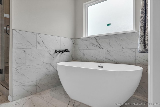 5769 S 256th E Ave, Broken Arrow, OK 74014 - full bath featuring plenty of natural light, marble finish floors, a freestanding bath, and tile walls