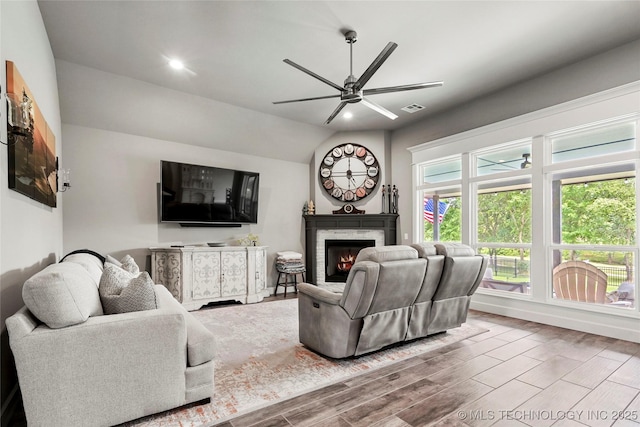 8617 E Hartford St, Broken Arrow, OK 74014 - living room with ceiling fan, wood finished floors, a glass covered fireplace, lofted ceiling, and recessed lighting