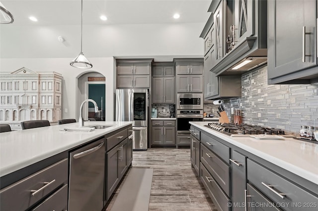 8617 E Hartford St, Broken Arrow, OK 74014 - kitchen featuring appliances with stainless steel finishes, a sink, gray cabinets, light countertops, and recessed lighting