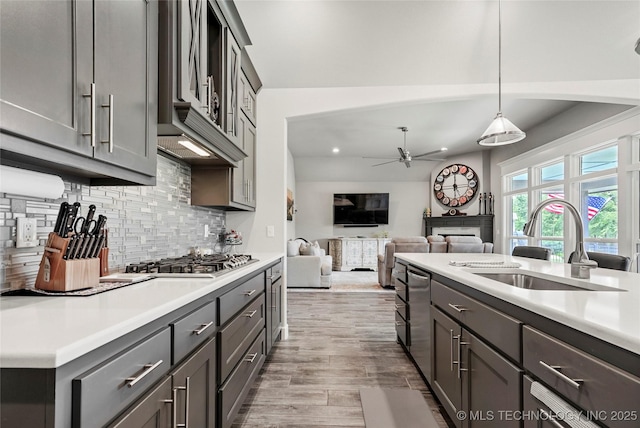 8617 E Hartford St, Broken Arrow, OK 74014 - kitchen featuring stainless steel appliances, a sink, tasteful backsplash, light countertops, and recessed lighting
