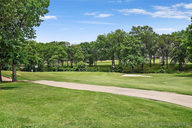 8617 E Hartford St, Broken Arrow, OK 74014 - surrounding community featuring view of golf course, a lawn, and view of wooded area