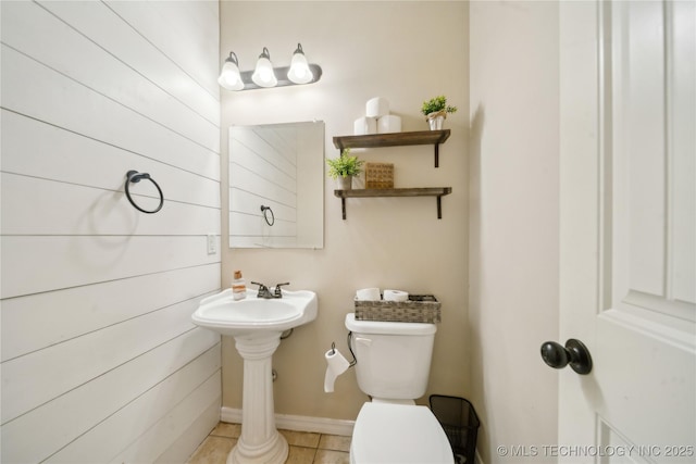 2704 W Imperial St, Broken Arrow, OK 74011 - bathroom featuring toilet, tile patterned floors, wood walls, and a sink