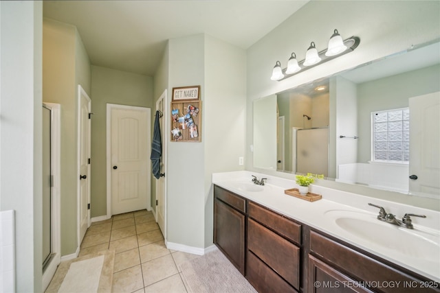 2704 W Imperial St, Broken Arrow, OK 74011 - full bathroom with a stall shower, double vanity, tile patterned flooring, and baseboards