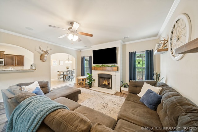 2704 W Imperial St, Broken Arrow, OK 74011 - living area featuring arched walkways, a ceiling fan, crown molding, and wood finished floors