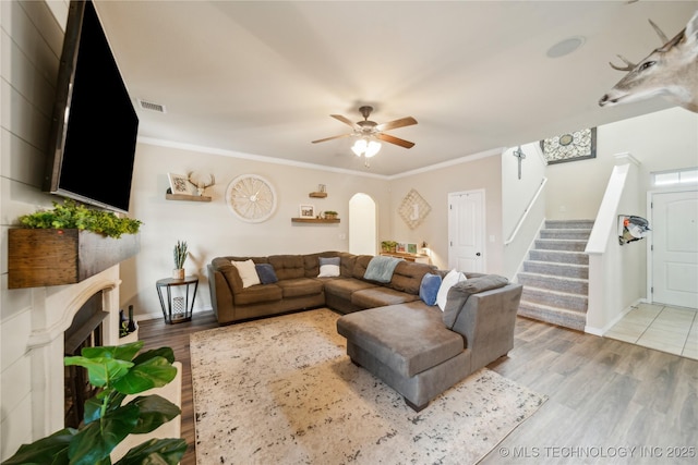 2704 W Imperial St, Broken Arrow, OK 74011 - living area featuring stairway, ceiling fan, light wood-style floors, baseboards, and ornamental molding