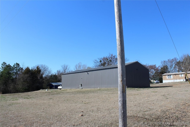 232 N Erie St, Eufaula, OK 74425 - view of side of property with an outbuilding and an outdoor structure