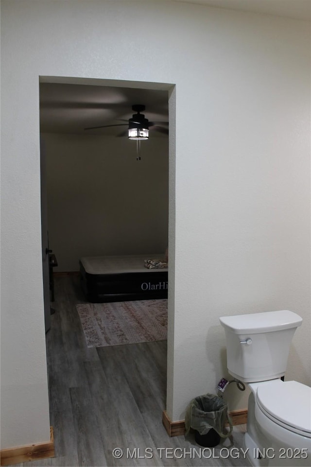 232 N Erie St, Eufaula, OK 74425 - bathroom with wood finished floors and a ceiling fan