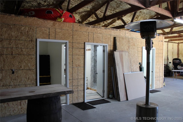 232 N Erie St, Eufaula, OK 74425 - miscellaneous room featuring concrete floors and vaulted ceiling