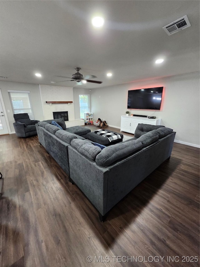 2230 Robin Ln, Muskogee, OK 74403 - living area with dark wood finished floors, plenty of natural light, recessed lighting, a ceiling fan, and a fireplace