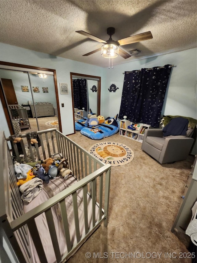 2230 Robin Ln, Muskogee, OK 74403 - living room featuring carpet floors, a ceiling fan, and a textured ceiling